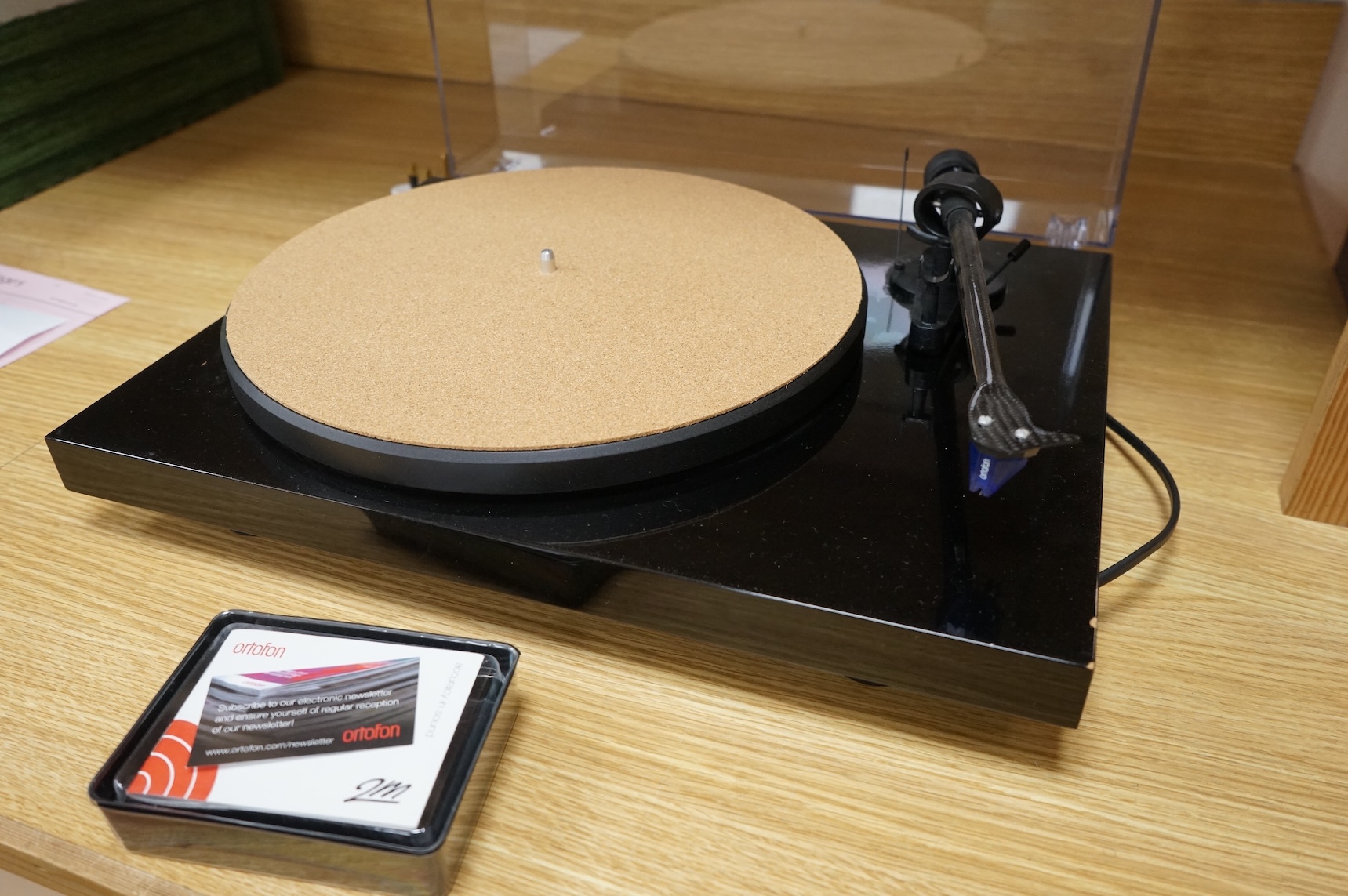 A Project Debut Carbon turntable with Ortofon 2m blue stylus and spare Ortofon 2m red stylus